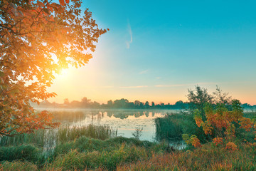 Wall Mural - Early morning, sunrise over the lake. Rural landscape. HDR