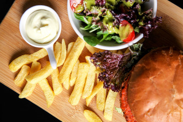 Wall Mural - Vegan burger with salad, and french fries