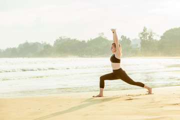 Wall Mural - girl doing fitness on the beach