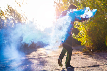 smoke bomb urban lifestyle concept running and jumping f