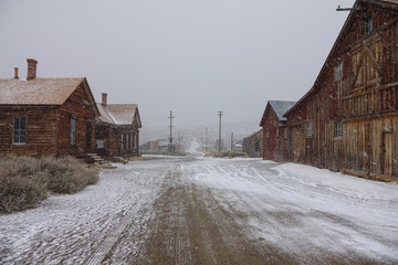 First snow of the winter covering the old wooden mining town in California.