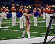 © Joe - Young college cheerleader performing at a college football game