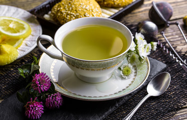 Tea in a cup on an old background