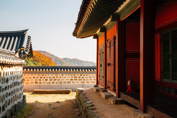 Sticker - Namhansanseong Fortress, Korean old traditional house with autumn maple in Gwangju, Korea