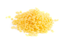 Pile Of Natural Yellow Beeswax Pearls On A Wax Background