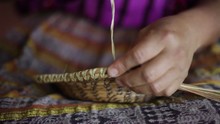 Close-up Of Hands Weaving A Basket.