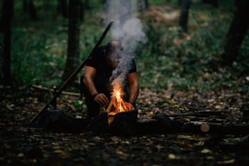 Hand man making camp fire on outdoor