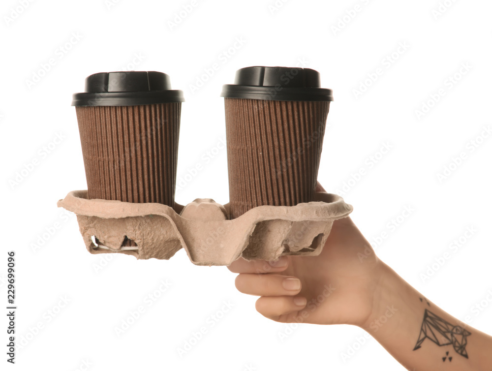 Woman holding paper coffee cups on white background