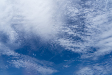 Wall Mural - view of beautiful abstract splash soft white cloudscape with shades of bright blue sky background fr