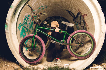 Wall Mural - Young man standing bmx bike. BMX rider 