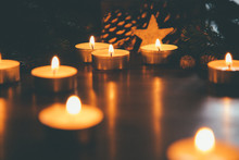Christmas Candles With Ornaments In The Night