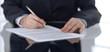 © rogerphoto - Close-up of female hands with pen over document,  business concept. Lawyer or business woman at work in office
