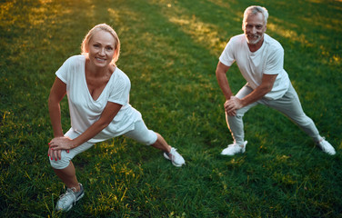 Wall Mural - Senior couple doing sport outdoors