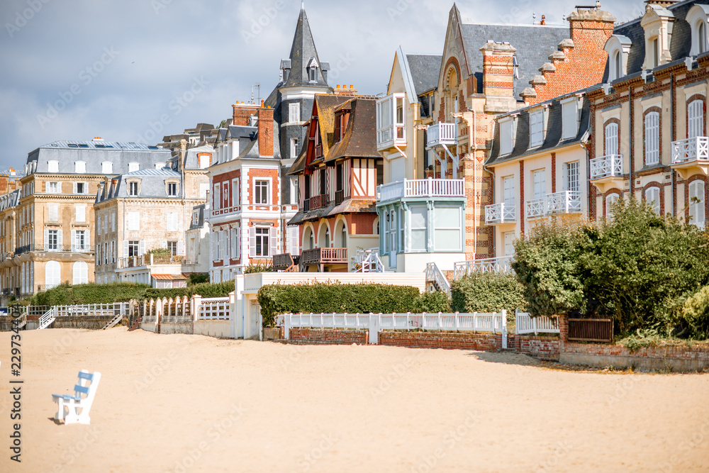 Luxury buildings on the coastline of Trouville, famous french resort in Normandy - obrazy, fototapety, plakaty 