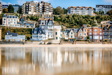 Wall Mural - View on the cooastline with sandy beach and luxury buildings in Trouville, famous french town in Normandy