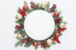 © LIGHTFIELD STUDIOS - top view of pine tree wreath with Christmas decorations and round blank space in middle isolated on white