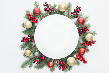 Wall Mural - top view of pine tree wreath with christmas decorations and round blank space in middle isolated on 