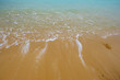 Soft wave of water on the sandy beach