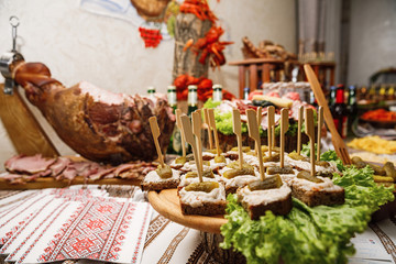 Wall Mural - Catering banquet table with different food snacks and appetizers