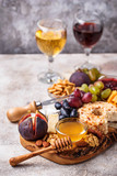Fototapeta Dziecięca - Cheese plate with grapes and wine