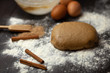 © Evgeniya Grishkina - The process of preparing dough for Christmas cookies with cinnamon, ginger and sugar. On a dark brown background sprinkle with flour. Ingredients for cookies. New year's magic. With the blur