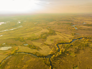 aerial summer landscape field with trees and grass, lakes and rivers panorama f