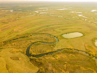 aerial summer landscape field with trees and grass, lakes and rivers panorama f