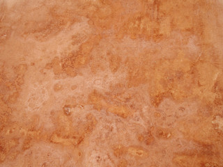 Wall Mural - close up of a rough textured ocher stone wall background