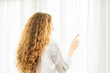 © pic for you - Young women are relaxing after waking up in the morning.Young woman stand up looking at the window relaxing in her bedroom
