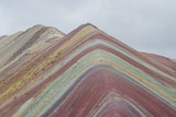Fototapeta Tęcza - Vinicunca, also called Montaña de Siete Colores, Montaña de Colores or Rainbow Mountain, in a cloudy day, in Perù.