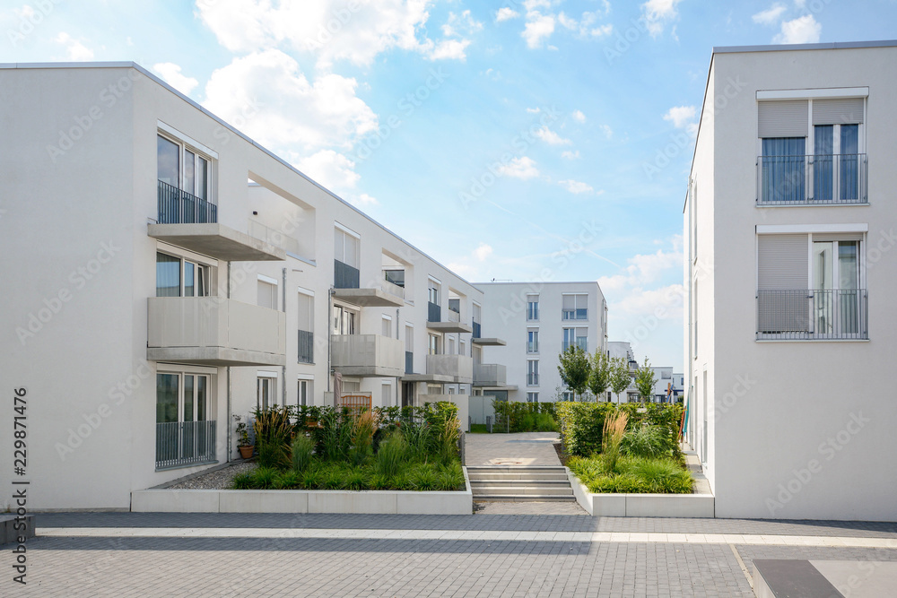 Modern apartment buildings in a new residential area in the city - obrazy, fototapety, plakaty 