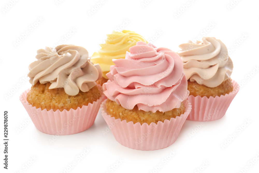 Delicious cupcakes on white background