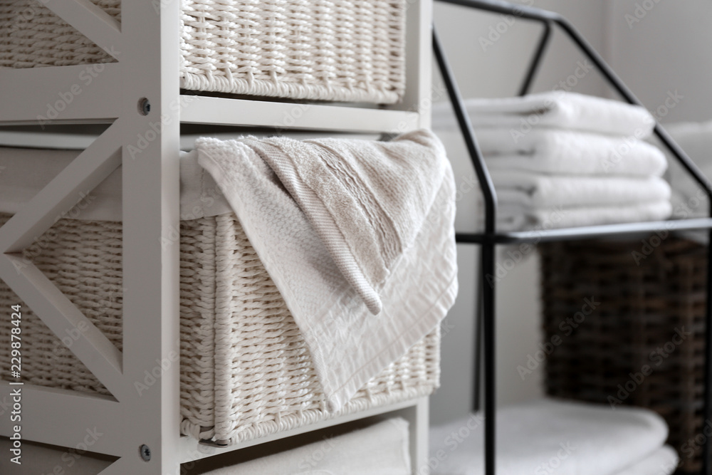 Laundry basket with soft towels on shelf