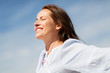 © Syda Productions - people and leisure concept - happy smiling woman enjoying sun