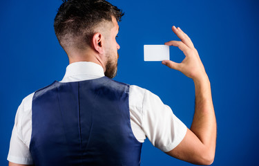 Banking and credit concept. Plastic bank card. Easy money credit. Which bank credit card is easy to get. Man hold plastic blank card blue background rear view. Take this card