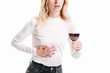 © LIGHTFIELD STUDIOS - cropped image of woman showing liver pain and holding glass of red wine isolated on white
