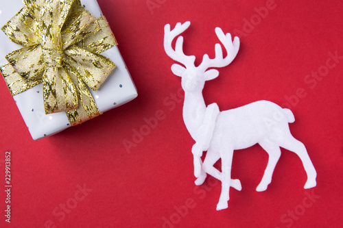 Elegant Gift Box Wrapped In Silver Paper Tied With Golden Ribbon