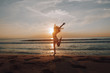 © pha88 - Happy girl at sunset by the sea.Silhouette photo