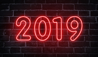 Neon glowing 2019 new year advertising design on wall