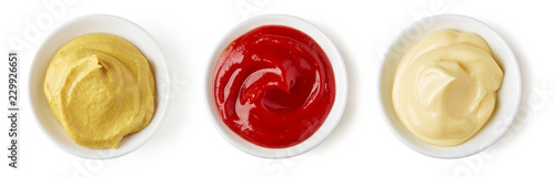 Fotomural Ketchup mayonnaise and mustard isolated on white, from above