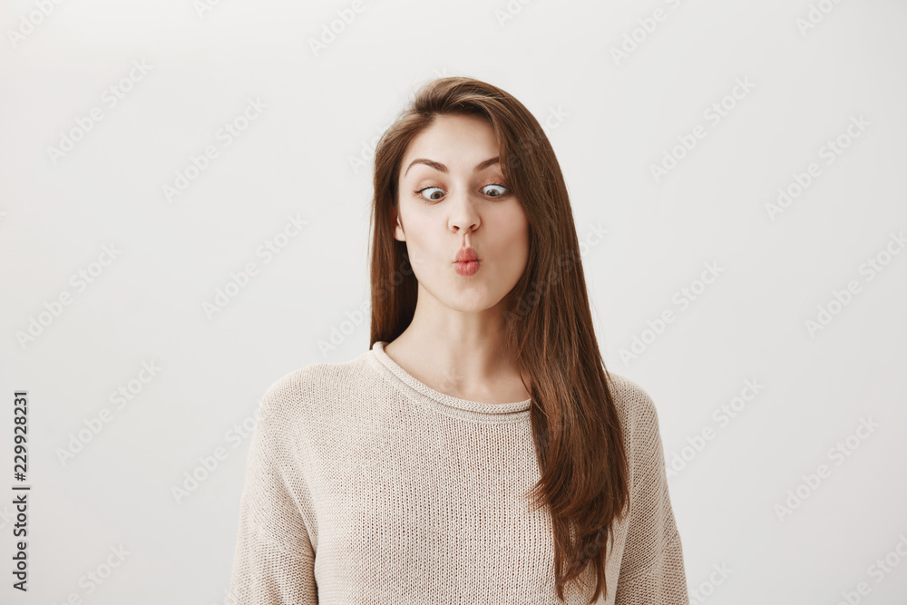 We all kids inside. Portrait of funny emotive adult female folding lips ...