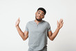 © Prostock-studio - Confused black manraising his hands and looking at camera
