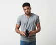 © Prostock-studio - Unhappy african-american man showing empty wallet at studio