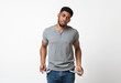 © Prostock-studio - Poor sad african-american man showing empty pockets