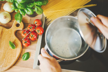 Poster - Man cooking pasta in boiling water