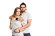 © A Stock Studio - Portrait of happy couple on white background. Couple man and woman hugging and looking at camera.