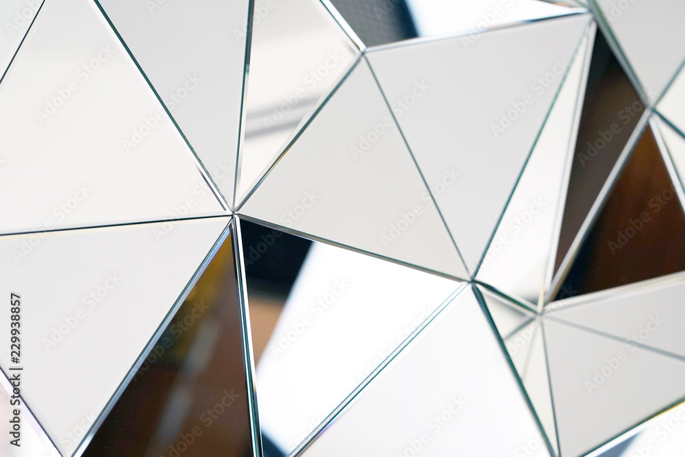 Mirror with crystals in wall, decoration and reflection. Abstract glass background. Polygonal surface. Close-up. Texture. - obrazy, fototapety, plakaty 