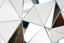 Mirror With Crystals In Wall, Decoration And Reflection. Abstract Glass Background. Polygonal Surface. Close-up. Texture.