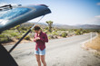 © Stocksy - A young woman hiking between cacti in the California desert