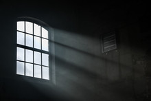Sunlight Shining Throuh The Windows Of An Old Abandoned Industrial Warehouse Building